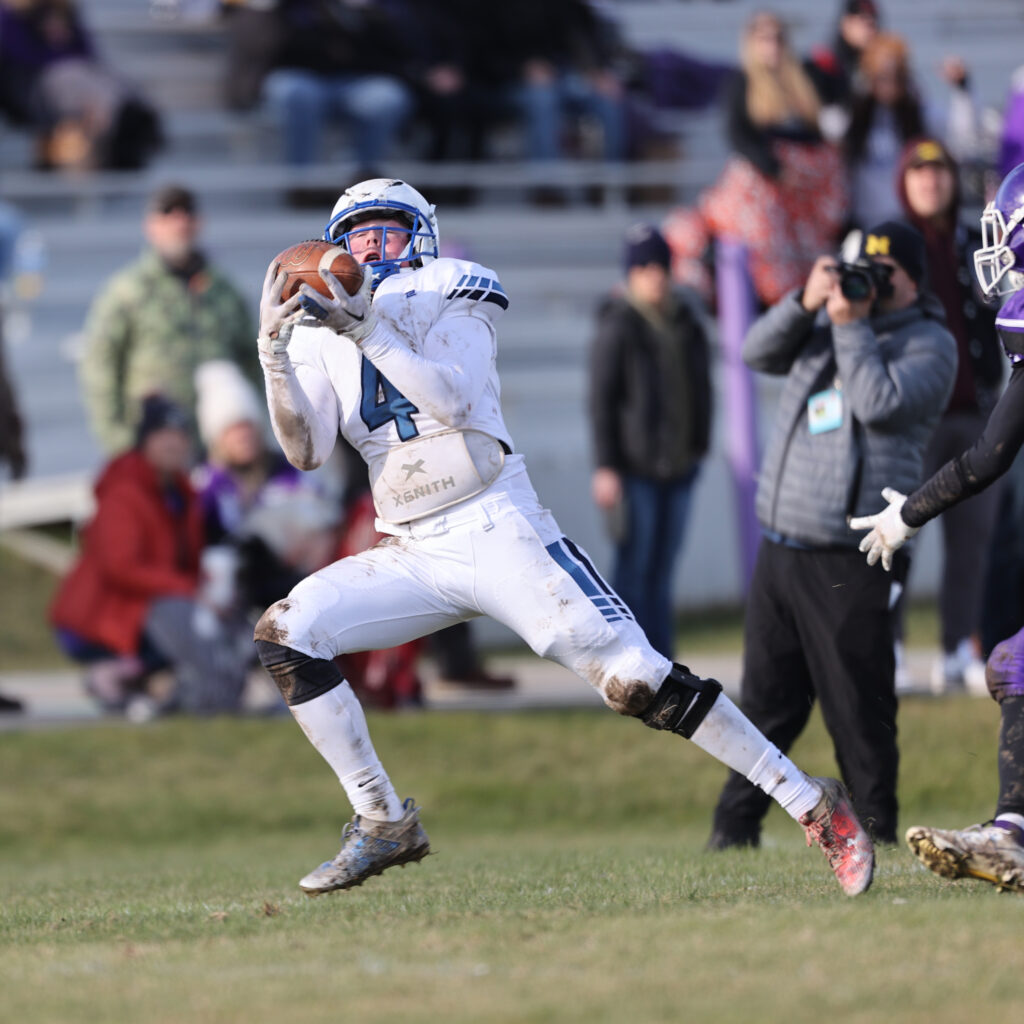 Senior Jacob Wiley catches a long pass during the Inland Lakes Bulldogs' 12-0 victory over Pickford in the 8-man semifinal on November 11, 2023. 